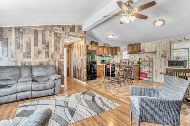 125 Loggers Ln, Clinton, TN 37716 - living room featuring wooden walls, ceiling fan, and light wood-type flooring