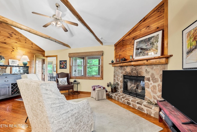 132 Cutter Gap Rd, Townsend, TN 37882 - living room featuring wood walls, a stone fireplace, wood finished floors, and ceiling fan