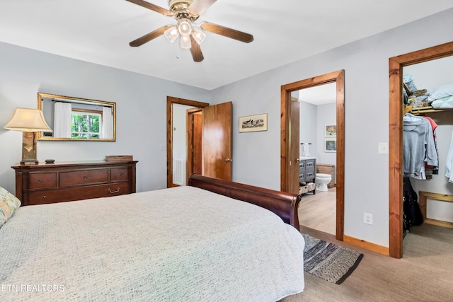 132 Cutter Gap Rd, Townsend, TN 37882 - carpeted bedroom with a walk in closet, connected bathroom, a closet, and multiple windows
