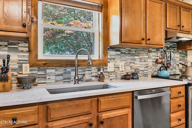 132 Cutter Gap Rd, Townsend, TN 37882 - kitchen with dishwasher, tasteful backsplash, extractor fan, light countertops, and brown cabinets