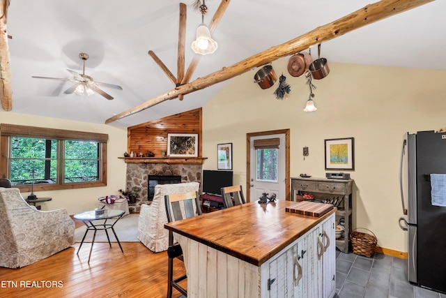 132 Cutter Gap Rd, Townsend, TN 37882 - kitchen featuring freestanding refrigerator, butcher block counters, open floor plan, ceiling fan, and a fireplace