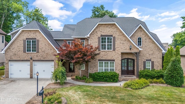 1219 Barton Place Ln, Knoxville, TN 37922 - view of front of home with a front lawn, concrete driveway, and brick siding