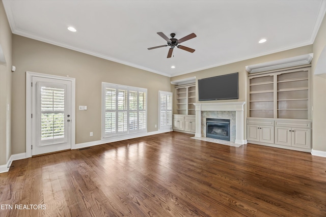 1219 Barton Place Ln, Knoxville, TN 37922 - unfurnished living room featuring a ceiling fan, a tile fireplace, wood finished floors, crown molding, and recessed lighting