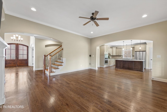 1219 Barton Place Ln, Knoxville, TN 37922 - unfurnished living room featuring stairs, dark wood-style floors, ceiling fan, arched walkways, and french doors