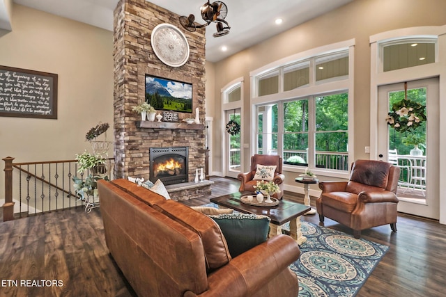 265 Falling Leaf Rd, Jamestown, TN 38556 - living room with wood finished floors, a stone fireplace, recessed lighting, a towering ceiling, and a chandelier