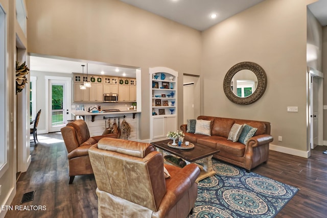 265 Falling Leaf Rd, Jamestown, TN 38556 - living room featuring dark wood-type flooring, a high ceiling, and recessed lighting