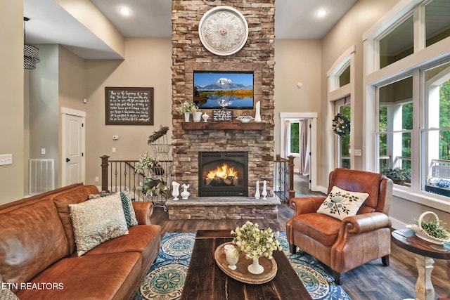 265 Falling Leaf Rd, Jamestown, TN 38556 - living room with wood finished floors, a fireplace, and a high ceiling