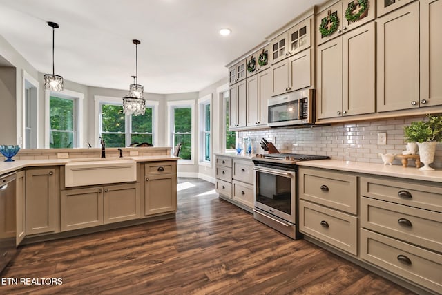 265 Falling Leaf Rd, Jamestown, TN 38556 - kitchen with appliances with stainless steel finishes, light countertops, decorative backsplash, dark wood-type flooring, and recessed lighting