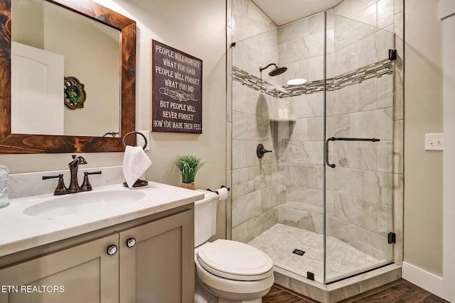 265 Falling Leaf Rd, Jamestown, TN 38556 - bathroom featuring vanity, a shower stall, and wood finished floors