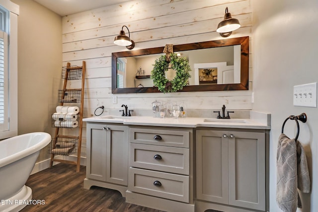 265 Falling Leaf Rd, Jamestown, TN 38556 - full bathroom with double vanity, wood finished floors, and a freestanding tub
