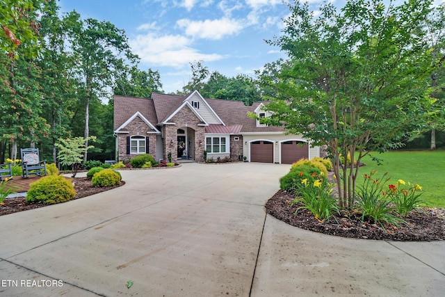 265 Falling Leaf Rd, Jamestown, TN 38556 - craftsman house with driveway, stone siding, an attached garage, and a front yard