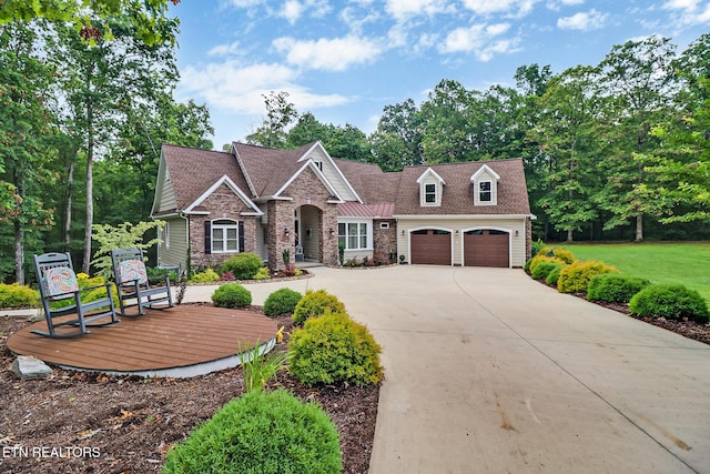 265 Falling Leaf Rd, Jamestown, TN 38556 - craftsman inspired home with stone siding, concrete driveway, and a shingled roof