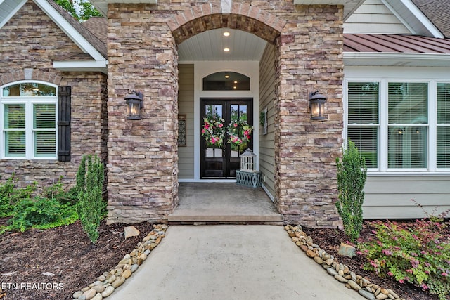 265 Falling Leaf Rd, Jamestown, TN 38556 - doorway to property featuring a standing seam roof, stone siding, french doors, and a metal roof