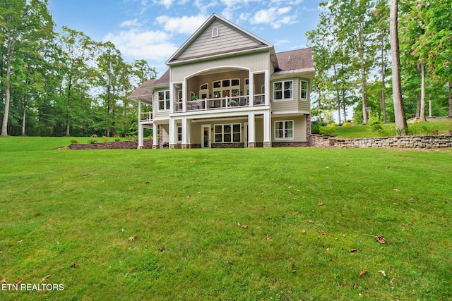 265 Falling Leaf Rd, Jamestown, TN 38556 - back of house featuring a balcony and a lawn