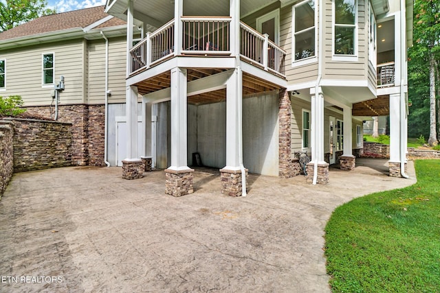 265 Falling Leaf Rd, Jamestown, TN 38556 - back of property featuring a patio, a balcony, and stone siding