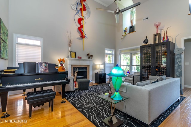 1155 Evelyn Mae Way, Knoxville, TN 37923 - living room with a towering ceiling, wood finished floors, a fireplace, and ceiling fan