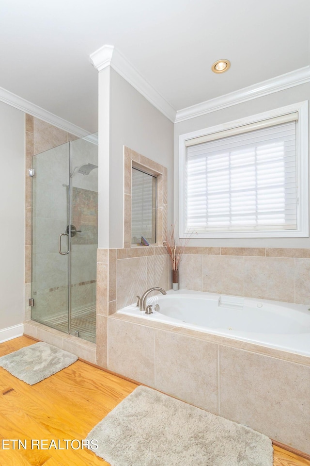 1155 Evelyn Mae Way, Knoxville, TN 37923 - bathroom with a garden tub, a stall shower, crown molding, and wood finished floors