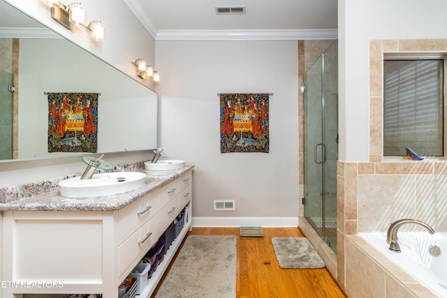 1155 Evelyn Mae Way, Knoxville, TN 37923 - full bath featuring double vanity, a bath, a stall shower, wood finished floors, and crown molding