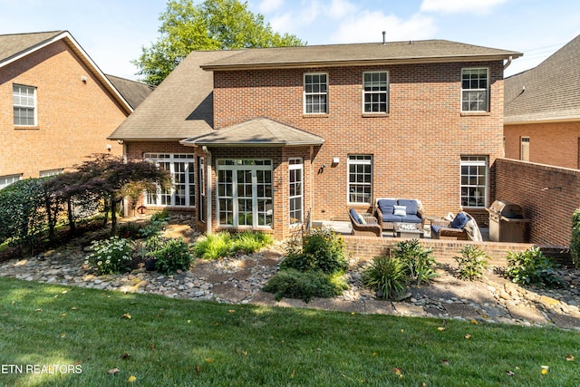 1155 Evelyn Mae Way, Knoxville, TN 37923 - back of house featuring an outdoor hangout area, brick siding, a patio, and roof with shingles