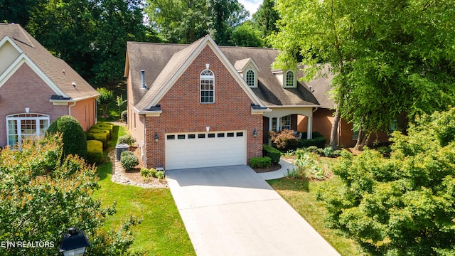 1155 Evelyn Mae Way, Knoxville, TN 37923 - traditional home with brick siding, driveway, and view of scattered trees