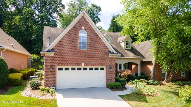 1155 Evelyn Mae Way, Knoxville, TN 37923 - traditional-style house with concrete driveway, brick siding, and a garage