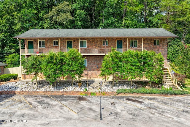 2810 Daybreak Way, Strawberry Plains, TN 37871 - view of front of home with uncovered parking, brick siding, and stairway