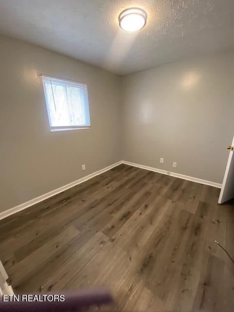 2810 Daybreak Way, Strawberry Plains, TN 37871 - spare room with baseboards and dark wood-style floors