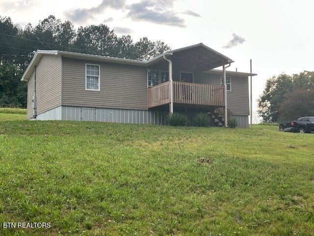 167 Loftis Rd, Parrottsville, TN 37843 - back of property featuring a yard and a wooden deck
