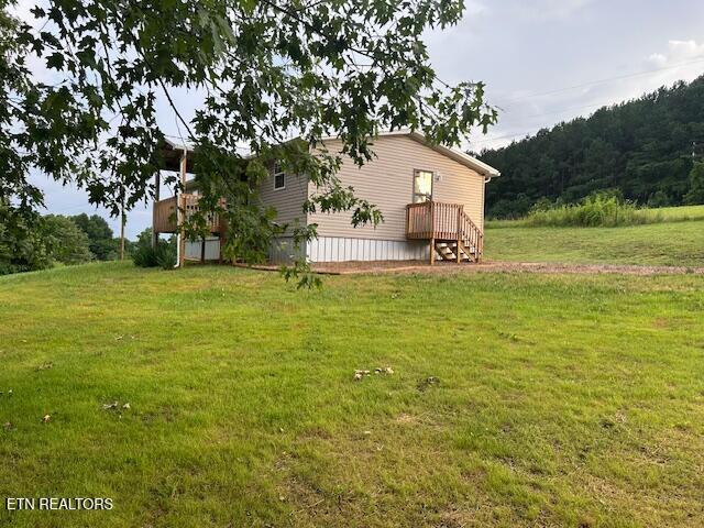 167 Loftis Rd, Parrottsville, TN 37843 - view of green lawn featuring a forest view