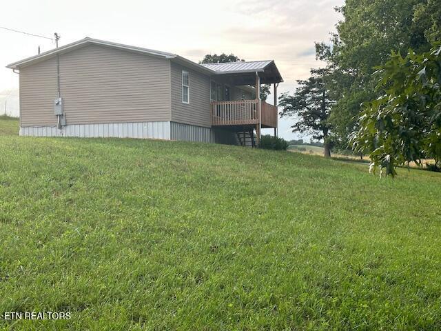 167 Loftis Rd, Parrottsville, TN 37843 - rear view of property featuring a lawn