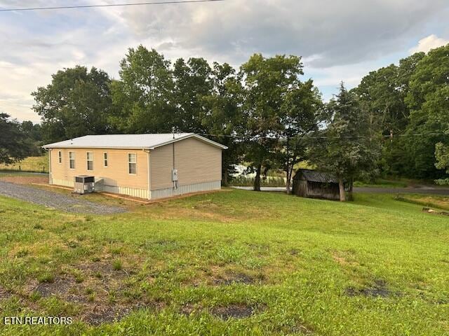 167 Loftis Rd, Parrottsville, TN 37843 - view of home's exterior with a shed and a lawn