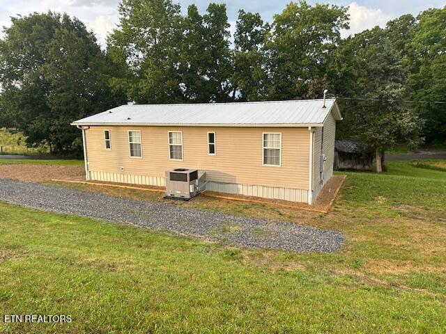 167 Loftis Rd, Parrottsville, TN 37843 - rear view of house with a lawn and a deck