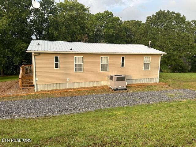 167 Loftis Rd, Parrottsville, TN 37843 - view of property exterior with a yard and a metal roof