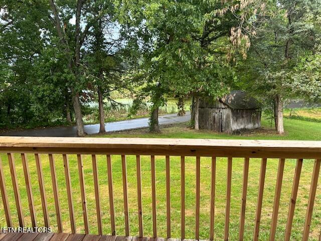 167 Loftis Rd, Parrottsville, TN 37843 - wooden deck featuring a lawn and a storage shed