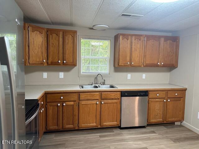 167 Loftis Rd, Parrottsville, TN 37843 - kitchen with appliances with stainless steel finishes, brown cabinets, and light wood-style flooring