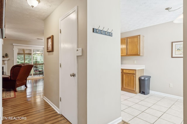8600 Olde Colony Trl Unit 106, Knoxville, TN 37923 - hall featuring a textured ceiling and baseboards