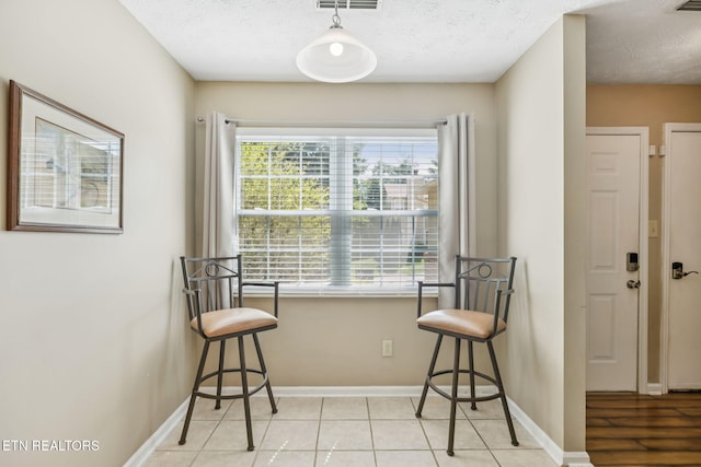 8600 Olde Colony Trl Unit 106, Knoxville, TN 37923 - dining area featuring baseboards and a textured ceiling