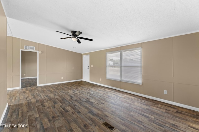 130 Hidden Estates Way, Newport, TN 37821 - empty room with ceiling fan, dark wood-style floors, a textured ceiling, a decorative wall, and crown molding