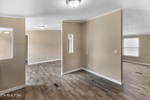 130 Hidden Estates Way, Newport, TN 37821 - unfurnished room with a textured ceiling, dark wood finished floors, and ornamental molding