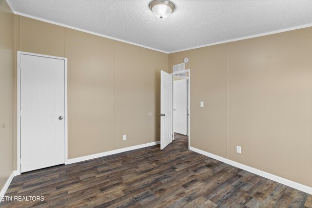 130 Hidden Estates Way, Newport, TN 37821 - unfurnished bedroom featuring dark wood-style floors, a textured ceiling, and ornamental molding