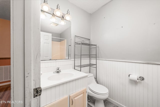 2019 Martha Washington Rd, Clarkrange, TN 38553 - bathroom featuring vanity, a wainscoted wall, a shower, and wood finished floors