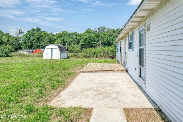 2019 Martha Washington Rd, Clarkrange, TN 38553 - view of yard featuring a storage shed, a deck, and a patio area