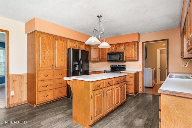 2019 Martha Washington Rd, Clarkrange, TN 38553 - kitchen with black appliances, washer / dryer, light countertops, brown cabinets, and dark wood-style floors