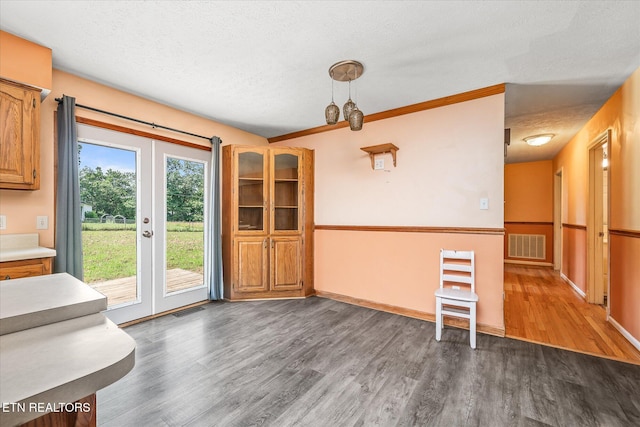 2019 Martha Washington Rd, Clarkrange, TN 38553 - unfurnished dining area featuring wood finished floors, a textured ceiling, and french doors