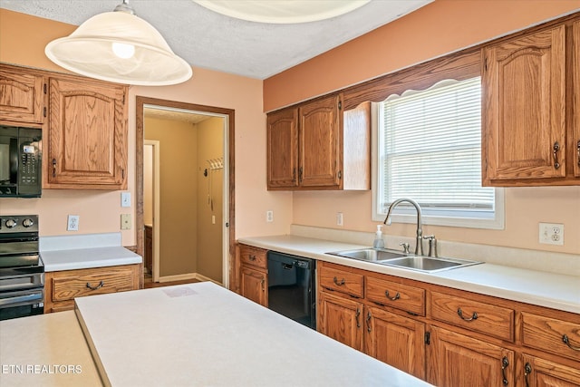 2019 Martha Washington Rd, Clarkrange, TN 38553 - kitchen featuring black appliances, light countertops, brown cabinetry, and a textured ceiling