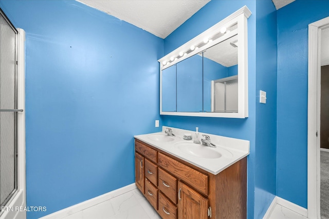 2019 Martha Washington Rd, Clarkrange, TN 38553 - full bath featuring double vanity, marble look tiles, and a textured ceiling