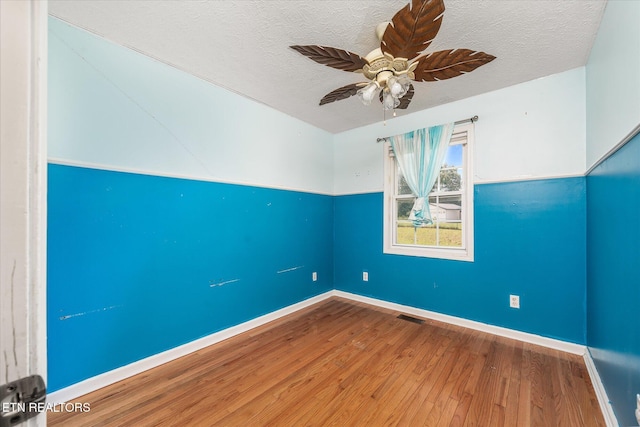 2019 Martha Washington Rd, Clarkrange, TN 38553 - spare room featuring wood finished floors, ceiling fan, and a textured ceiling