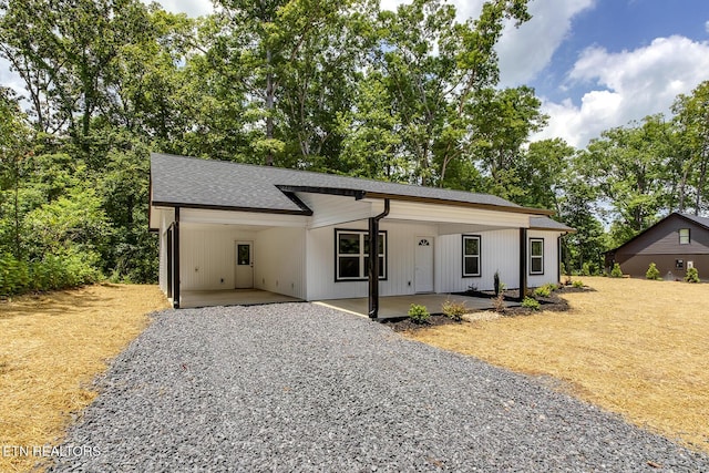 181 Lakeshore Ln, Decatur, TN 37322 - view of front of home featuring an attached carport, driveway, and a shingled roof