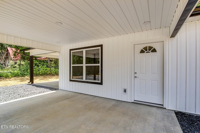 181 Lakeshore Ln, Decatur, TN 37322 - view of exterior entry featuring a patio area and board and batten siding