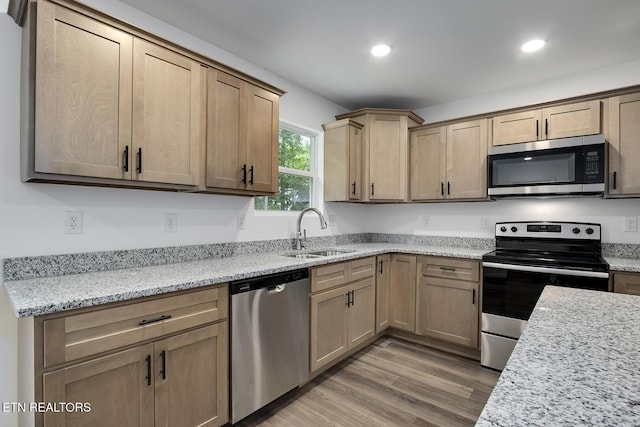 181 Lakeshore Ln, Decatur, TN 37322 - kitchen featuring appliances with stainless steel finishes, recessed lighting, light wood-style flooring, light stone counters, and light brown cabinetry